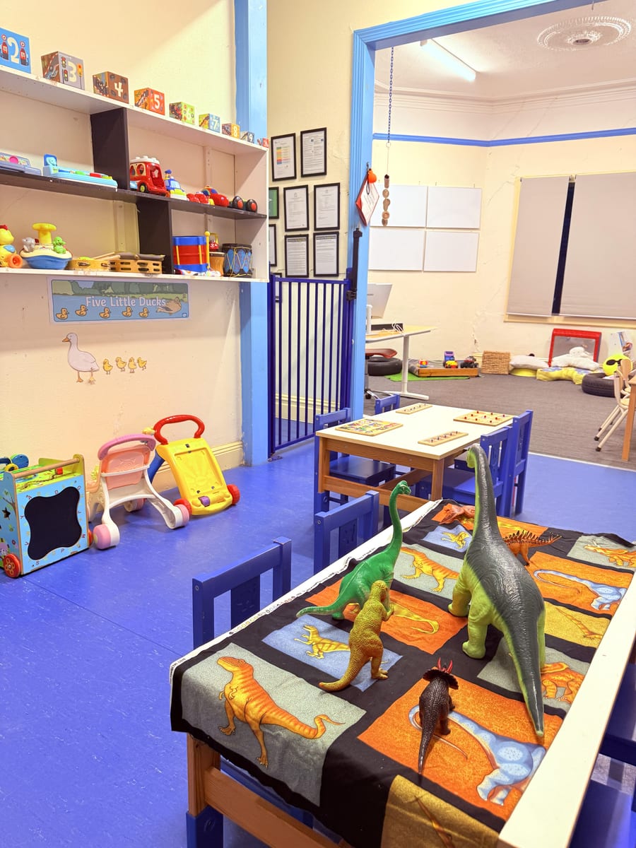 Rainbow Room — toddler play space with toy shelves and open floor